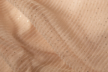 Concept with waves champagne mesh fabric. Retro fashion aesthetic. Can use as wedding background. Luxurious background design