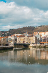 Obraz premium Scenic View of Bilbao City Hall by the Nervión River, Spain