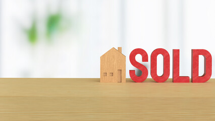 The Toy wood house and red sold text for Property or real estate concept 3d Rendering..