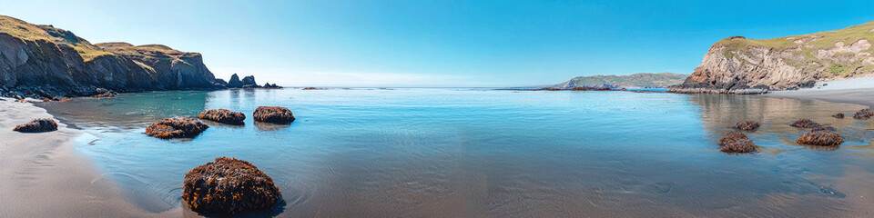 Naklejka premium Peaceful beach and rocks in water, panoramic view of landscape with clean ocean and blue sky. Concept of sea, banner