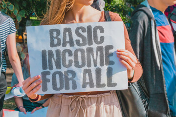 'Basic Income for All' is the main sentence. Equity. Redistribution. Welfare. Poverty. Employment....