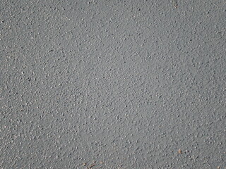grey rough sandy painted wall closeup