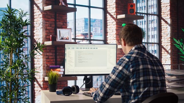 Software developer at computer coding, creating software, implementing algorithms. IT expert in home office working with code editor, building applications, optimizing performance, camera A