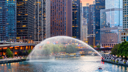 Chicago, Illinois riverfront and skyline at dusk. Chicago is the most populous city in the U.S....