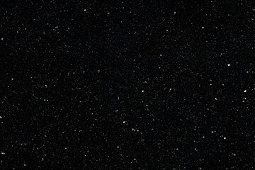 Dark Background Shows Tiny White Specks Scattered Across the Surface Evenly
