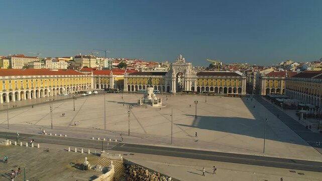 LISBON, PORTUGAL - JANUARY 22, 2025: Beautiful sunny day in Praca do Comercio with people enjoying the vibrant atmosphere