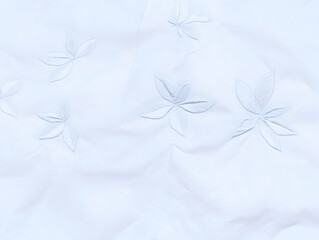 Delicate Embroidered Floral Pattern on Soft White Fabric Creates an Elegant Texture for Designs.