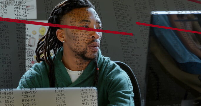 Image of financial data processing over biracial businessman using laptop in office