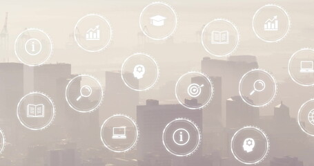 Image of business icons over cityscape