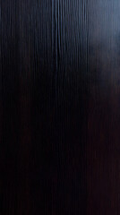 Dark Textured Surface Shows Subtle Waves and Ridges Evenly Distributed Across the Image.