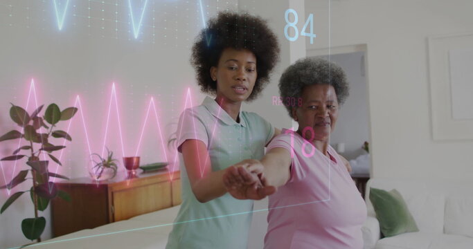 Image of cardiograph over senior biracial woman exercising with female nurse at home