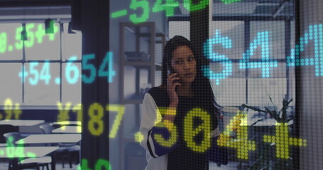 Image of financial data processing over biracial businesswoman using smartphone in office