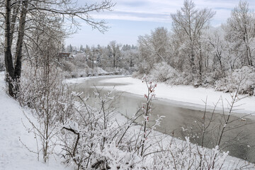 River flowing smoothly in winter landscape