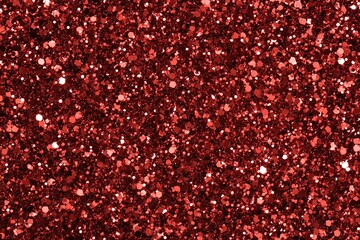 Red glitter sparkles brilliantly a shimmering texture