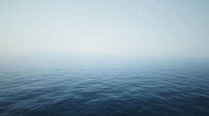 Obraz premium Serene view of calm ocean waters under a clear sky, evoking tranquility and peace