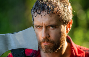 Man sweating with logging axe. Hardworking brutal man face. Logging lumberjack man outdoor. Brutal...