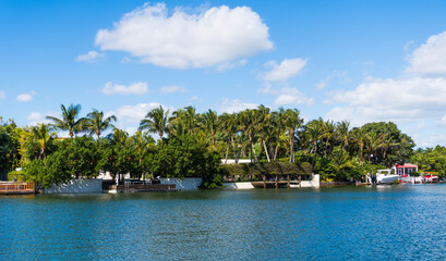 Landscape with luxury residential area. Residential waterfront apartment. Waterfront landscape with house. Vacation in summer. Luxury waterfront hotel building. Summer vacation
