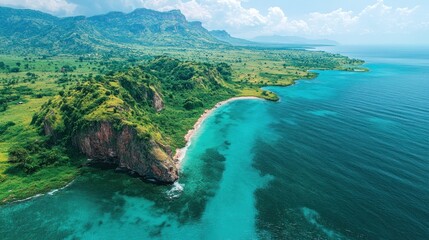 Fototapeta premium Stunning aerial view of lush green hills meeting a turquoise ocean bay