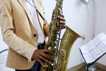 Fototapeta premium Close-up Fingers Pushing The Keys Playing Saxophone 