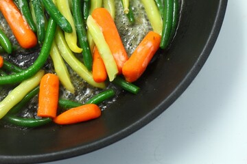 vegetables fried in a pan close up 