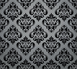 Wallpaper in the style of Baroque. Seamless vector background. Gray and black floral ornament. Graphic pattern for fabric, wallpaper, packaging. Ornate Damask flower ornament