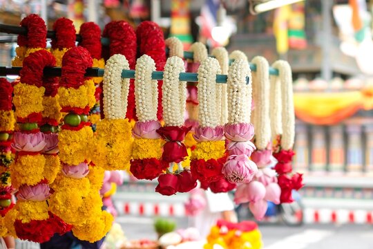 Flower garlands of marigold, jasmine, roses, lotus flowers for sale in front of Sri Maha Mariamman (or Maha Uma Devi Temple, Wat Phra Si Maha Umathewi or Wat Khaek) Tamil Hindu Temple - Si Lom Road