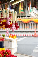 Flower garlands of marigold, jasmine, roses, lotus flowers for sale in front of Sri Maha Mariamman...