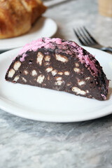 Chocolate dessert with pink icing