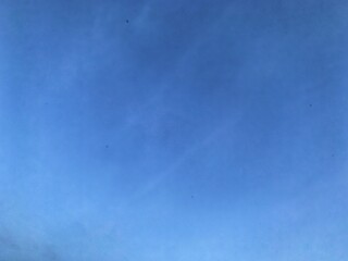 A view of a bright blue sky with white clouds, suitable for the background