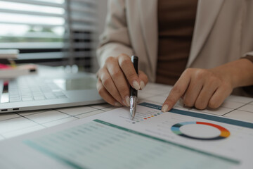 paperwork and report with businesswoman at work in office, computer, data and documents with female staff working on report or online paperwork review, businessperson is working in the office