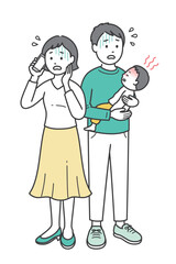 急な発熱をした子供を抱いて焦る若い父親と医療機関に電話する母親
