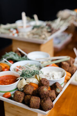 Delicious spread of savory appetizers and dips at a festive gathering in a cozy venue