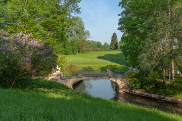 Slavyanka River Valley and the Centaur Bridge in the Pavlovsky Palace and Park Complex on a sunny summer day, Pavlovsk, Saint Petersburg, Russia