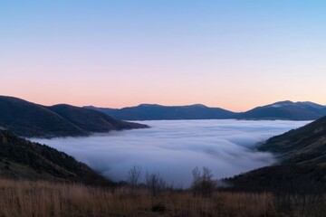 Mountain valley with cloud inversion with panoramic composition composition and sunrise lighting 