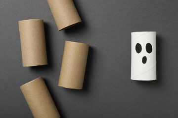 Paper rolls on gray background, top view