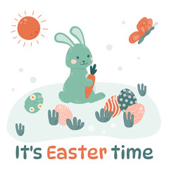 Easter bunny is sitting in a clearing with colored eggs spread out and gnawing on carrots.