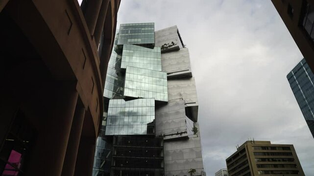 Wide angle reveal of Deloitte skyscraper in Vancouver which is constructed from off centred cube shaped blocks