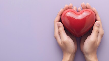 Fototapeta premium Hands Holding Red Heart Symbol on Soft Lavender Background