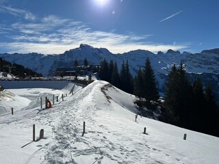 Wonderful winter hiking trails and traces in the fresh alpine snow cover of the Swiss Alps and over the tourist resort of Engelberg - Canton of Obwalden, Switzerland (Kanton Obwald, Schweiz)