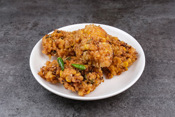 Perkedel Jagung or Bakwan Jagung, corn fritters made from corn, egg and flour. Indonesian food
