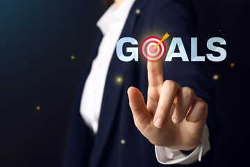 Businesswoman using virtual screen on dark background, closeup