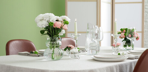 Festive table setting for wedding near green wall in dining room