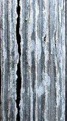 Weathered vertical wooden planks, cracked texture, grunge background,  industrial setting, design element