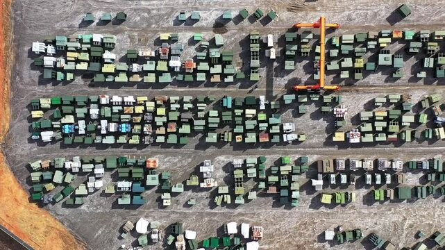 An aerial view of a moving gantry crane surrounded by transformers at Maddox Industrial Transformer in South Carolina.