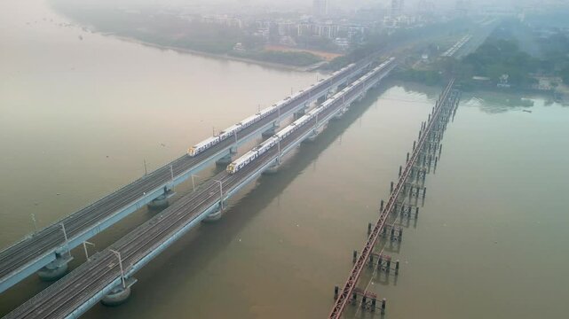 2 trains going from naigoan to bhayandar on vasai creek bridge bird eye view