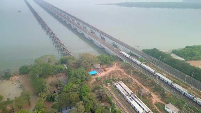 2 trains coming from naigoan to bhayandar on vasai creek bridge bird eye view