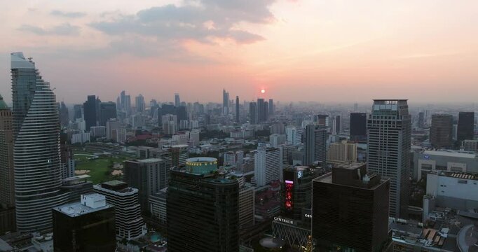 High-rise Modern Buildings, Offices, And Hotels During Sunset In Pathum Wan District, Bangkok, Thailand. - aerial shot