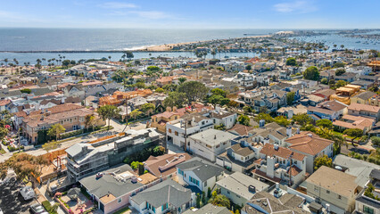 Obraz premium Luxury home, Newport Beach, ocean view, modern house, real estate, sunset photography, coastal property, high-end architecture, elegant design, premium listing, exterior lighting, waterfront home