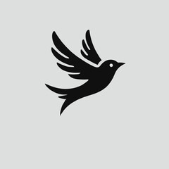 Fototapeta premium Flying Bird Silhouette in black on a white background