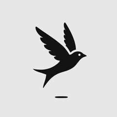 Obraz premium Flying Bird Silhouette in black on a white background